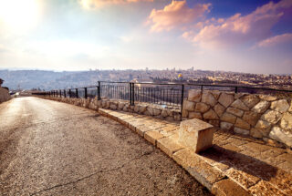 Asphalt road on Mount of Olives in Jerusalem. Panoramic view of old city Jerusalem, Israel
